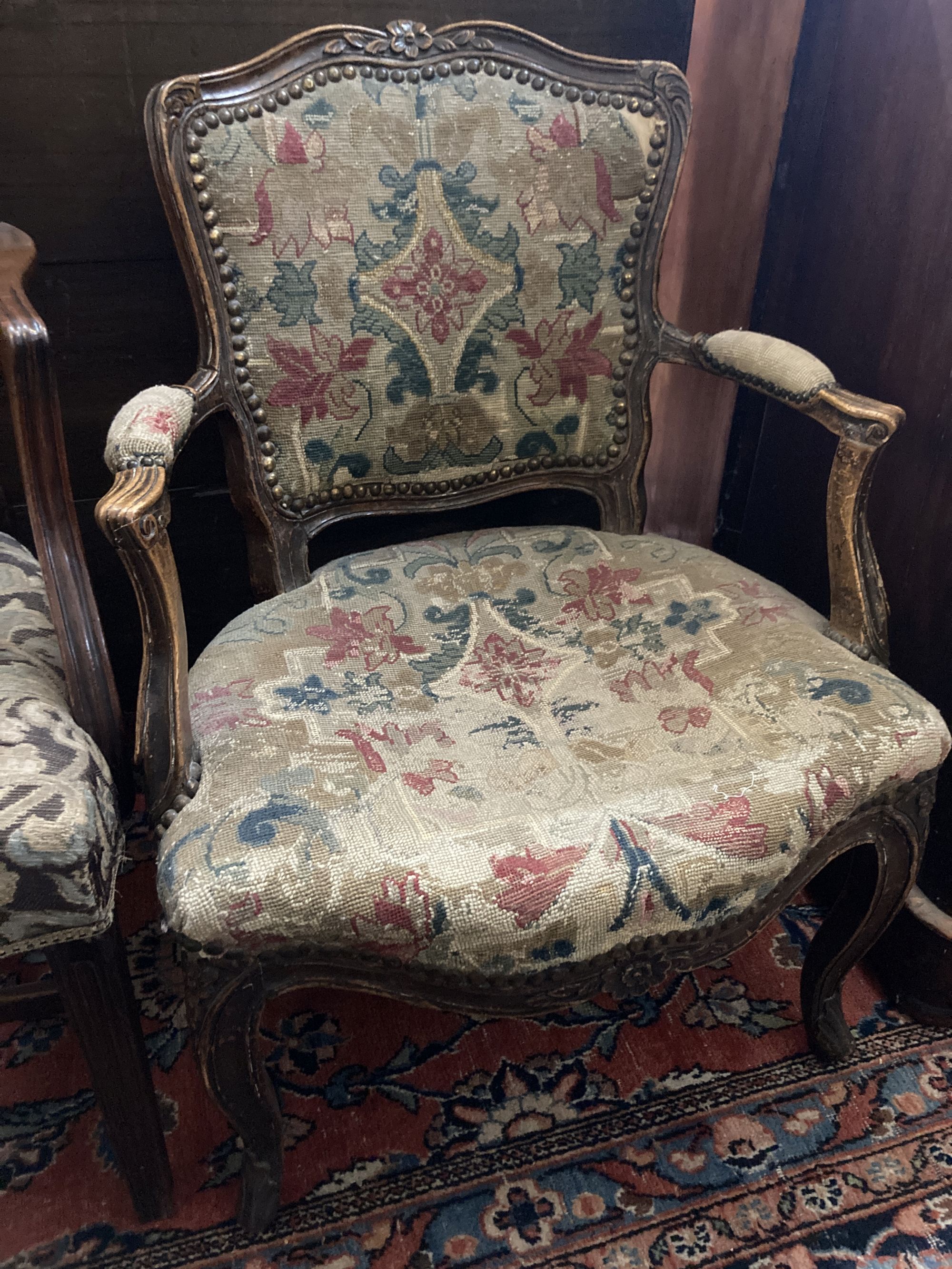 A Hepplewhite style mahogany armchair and a Louis XV walnut fauteuil covered in tapestry